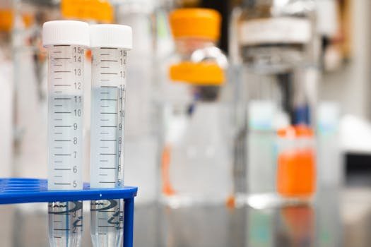 pexels-photo-954585-954585 Two clear test tubes in a laboratory, essential for scientific research.